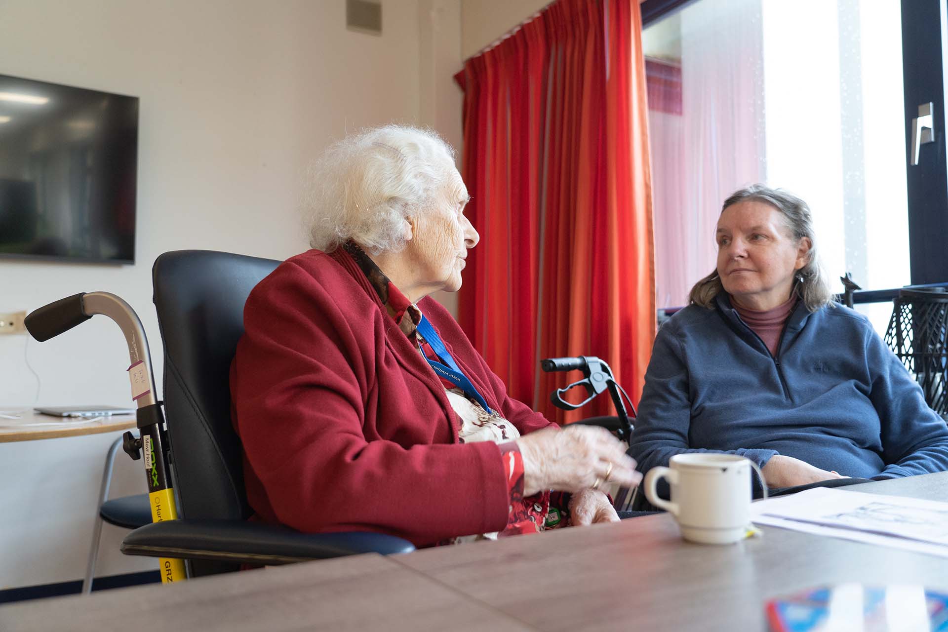 Elderly woman xwith her daughter's visit in a nursing home